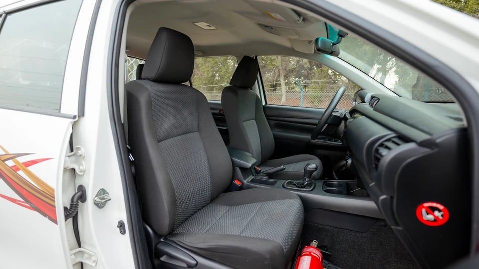 Used 2021 Toyota Hilux GLX Double Cabin in White – Front Passenger Side Cabin View for Sale at First Choice Cars Dubai Sharjah