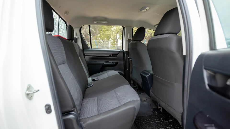 Used 2021 Toyota Hilux GLX Double Cabin in White – Rear Passenger Side Cabin View for Sale at First Choice Cars Dubai Sharjah