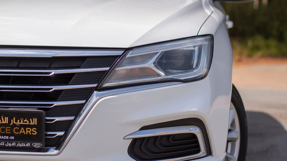 Used 2022 MG 5 Comfort in White – Headlight Close-up for Sale at First Choice Cars Dubai Sharjah