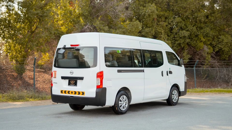 Used 2024 Nissan Urvan High Roof in White – Right Back Diagonal (45°) View for Sale at First Choice Cars Dubai Sharjah