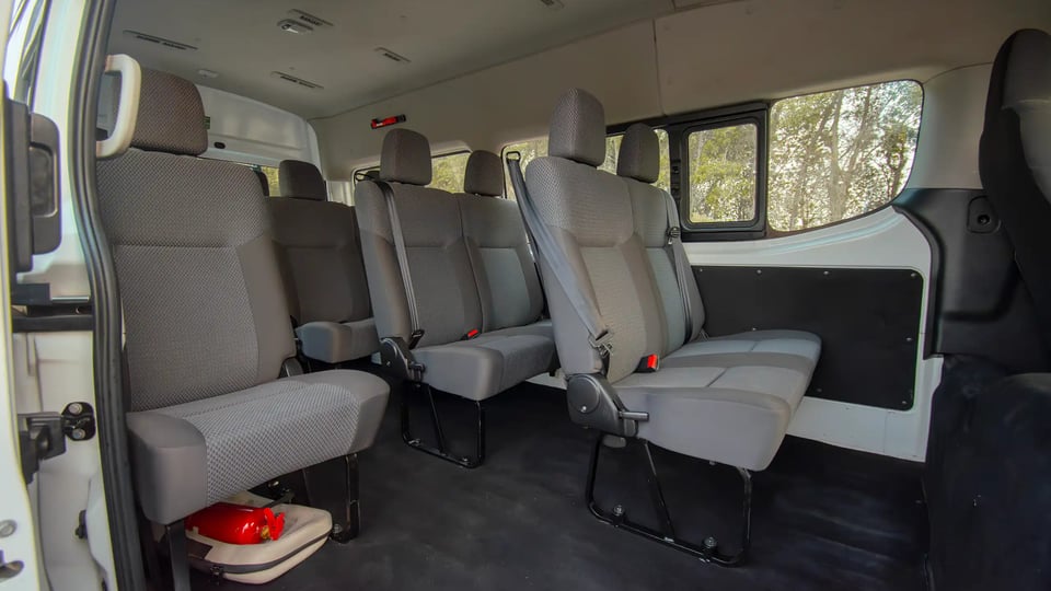 Used 2024 Nissan Urvan High Roof in White – Rear Passenger Side Cabin View for Sale at First Choice Cars Dubai Sharjah