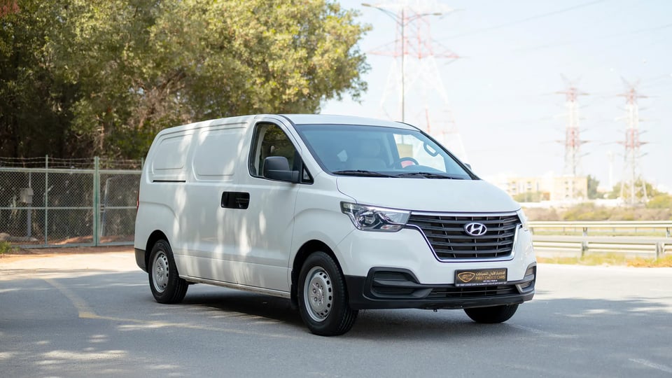 Used 2021 Hyundai H1 Cargo Van in White – Right Front Diagonal (45°) View for Sale at First Choice Cars Dubai Sharjah