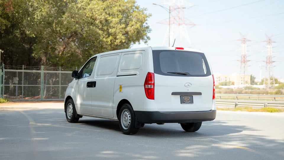 Used 2021 Hyundai H1 Cargo Van in White – Left Back Diagonal (45°) View for Sale at First Choice Cars Dubai Sharjah