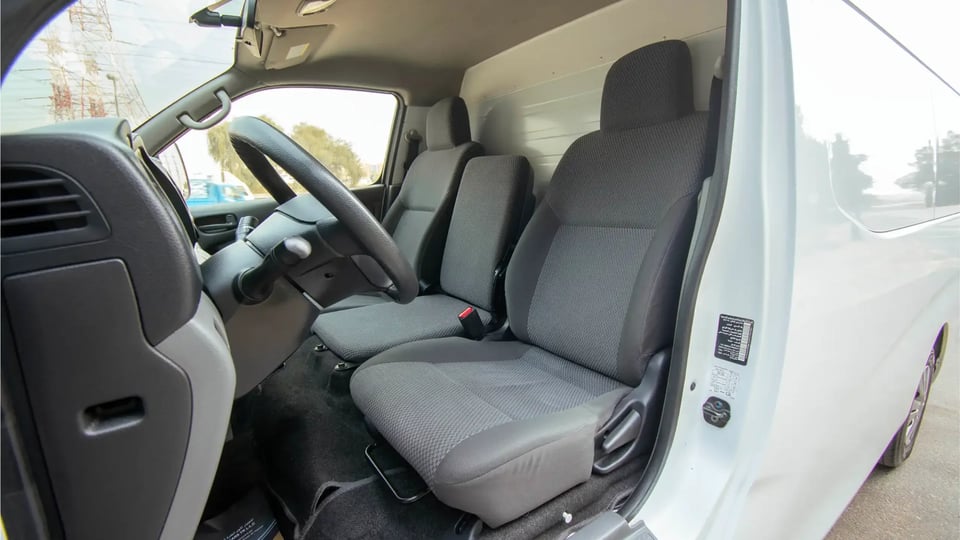 Used 2021 Nissan Urvan Standard Roof in White – Front Driver Side Cabin View for Sale at First Choice Cars Dubai Sharjah