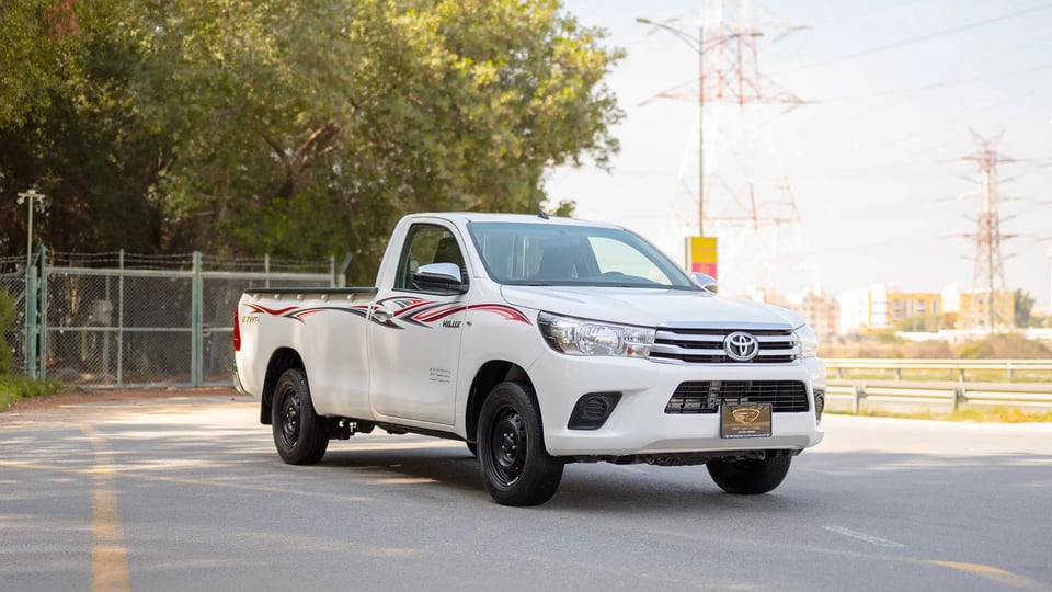 Used 2022 Toyota Hilux GLX Single Cabin in White – Right Front Diagonal (45°) View for Sale at First Choice Cars Dubai Sharjah