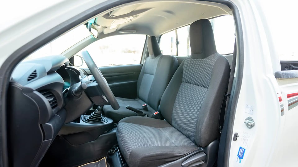 Used 2022 Toyota Hilux GLX Single Cabin in White – Front Driver Side Cabin View for Sale at First Choice Cars Dubai Sharjah