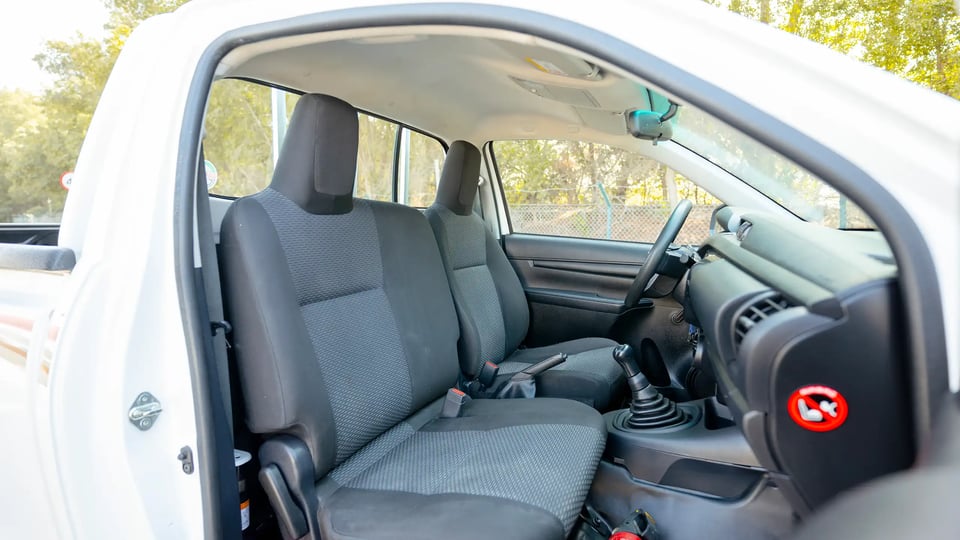 Used 2022 Toyota Hilux GLX Single Cabin in White – Front Passenger Side Cabin View for Sale at First Choice Cars Dubai Sharjah
