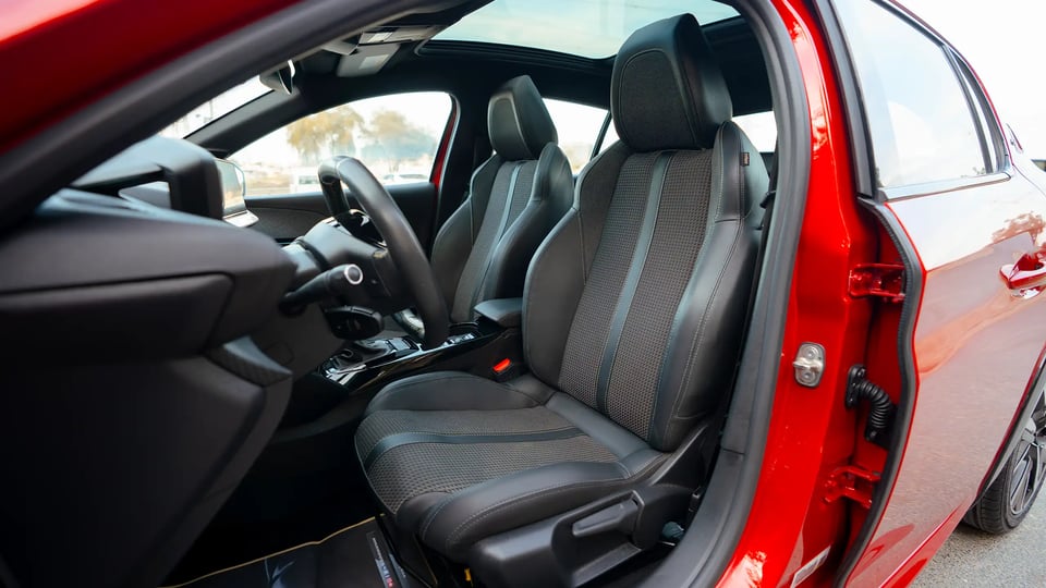 Used 2023 Peugeot 208 GT in Red – Front Driver Side Cabin View for Sale at First Choice Cars Dubai Sharjah