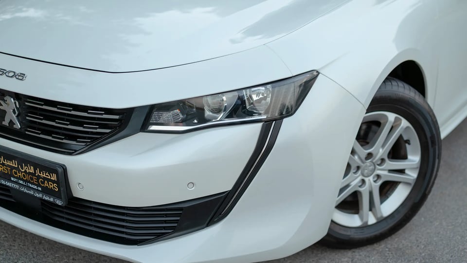 Used 2023 Peugeot 508 Allure in White – Headlight Close-up for Sale at First Choice Cars Dubai Sharjah