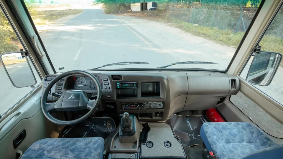 Used 2022 Mitsubishi Rosa Standard in White – Front Cabin / Dashboard Full View for Sale at First Choice Cars Dubai Sharjah