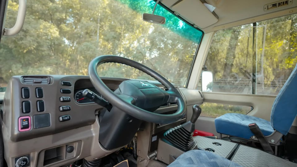 Used 2022 Mitsubishi Rosa Standard in White – Driver Side Dashboard & Steering View for Sale at First Choice Cars Dubai Sharjah