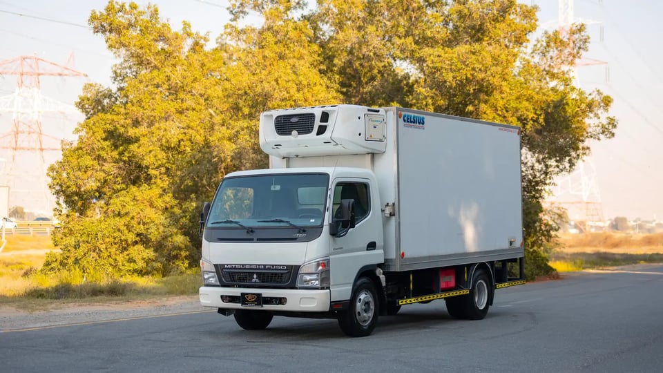 Used 2016 Mitsubishi Canter Freezer Box in White – Left Front Diagonal (45°) View for Sale at First Choice Cars Dubai Sharjah