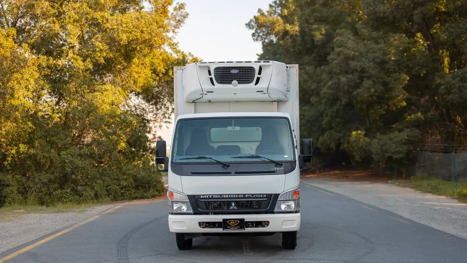 Used 2016 Mitsubishi Canter Freezer Box in White – Front View for Sale at First Choice Cars Dubai Sharjah