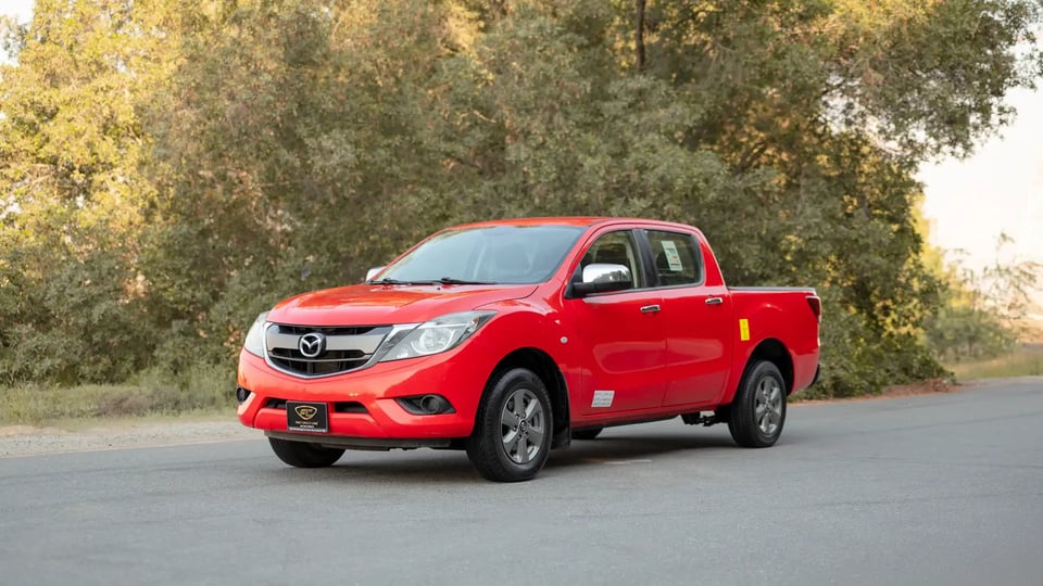 Used 2019 Mazda BT-50 XS in Red – Left Front Diagonal (45°) View for Sale at First Choice Cars Dubai Sharjah