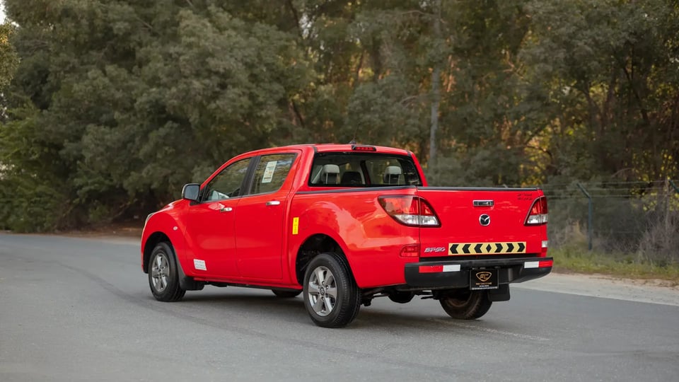 Used 2019 Mazda BT-50 XS in Red – Left Back Diagonal (45°) View for Sale at First Choice Cars Dubai Sharjah