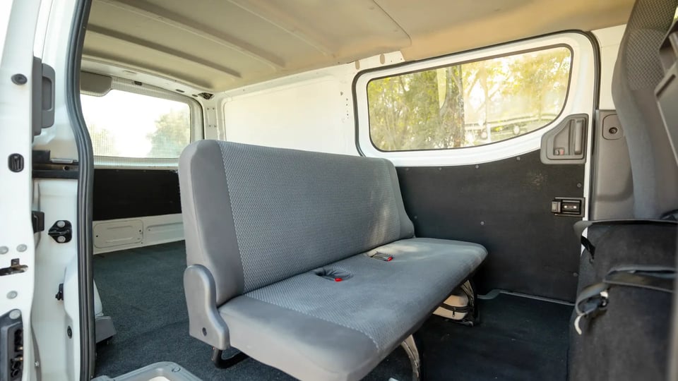 Used 2022 Nissan Urvan Standard Roof in White – Rear Passenger Side Cabin View for Sale at First Choice Cars Dubai Sharjah