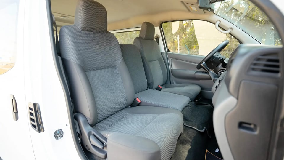 Used 2022 Nissan Urvan Standard Roof in White – Front Passenger Side Cabin View for Sale at First Choice Cars Dubai Sharjah