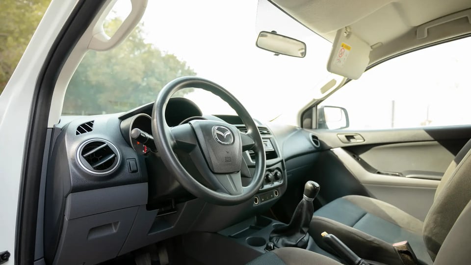 Used 2020 Mazda BT-50 XS in White – Driver Side Dashboard & Steering View for Sale at First Choice Cars Dubai Sharjah