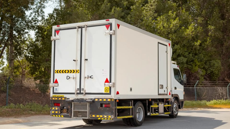 Used 2020 Mitsubishi Canter Freezer Box in White – Right Back Diagonal (45°) View for Sale at First Choice Cars Dubai Sharjah