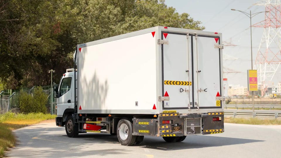 Used 2020 Mitsubishi Canter Freezer Box in White – Left Back Diagonal (45°) View for Sale at First Choice Cars Dubai Sharjah