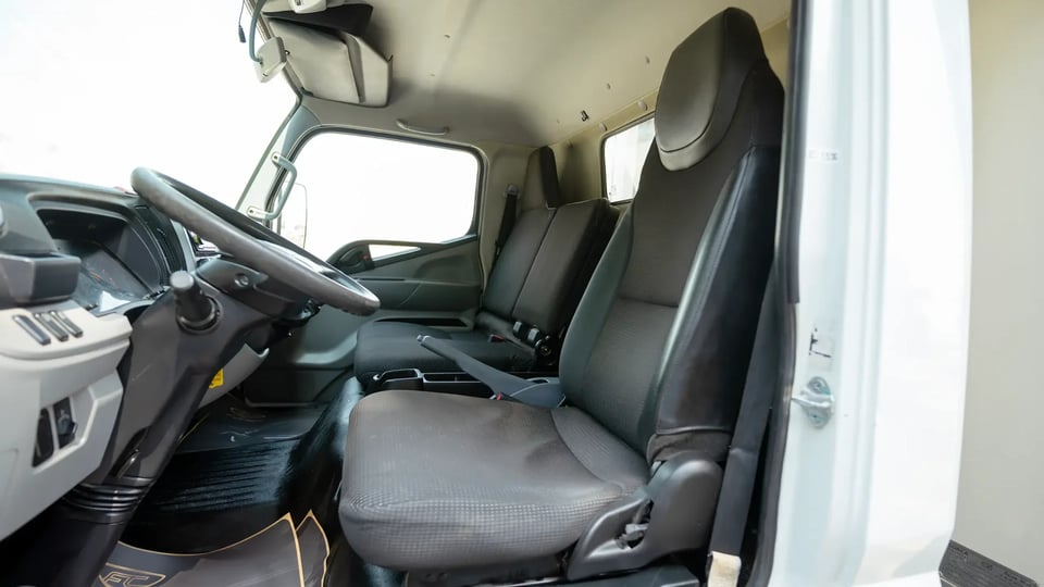 Used 2020 Mitsubishi Canter Freezer Box in White – Front Driver Side Cabin View for Sale at First Choice Cars Dubai Sharjah