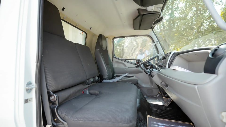 Used 2020 Mitsubishi Canter Freezer Box in White – Front Passenger Side Cabin View for Sale at First Choice Cars Dubai Sharjah