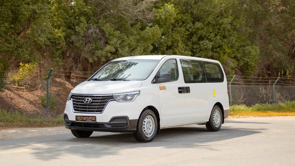 Used 2021 Hyundai H1 12-Seater Wagon in White – Left Front Diagonal (45°) View for Sale at First Choice Cars Dubai Sharjah