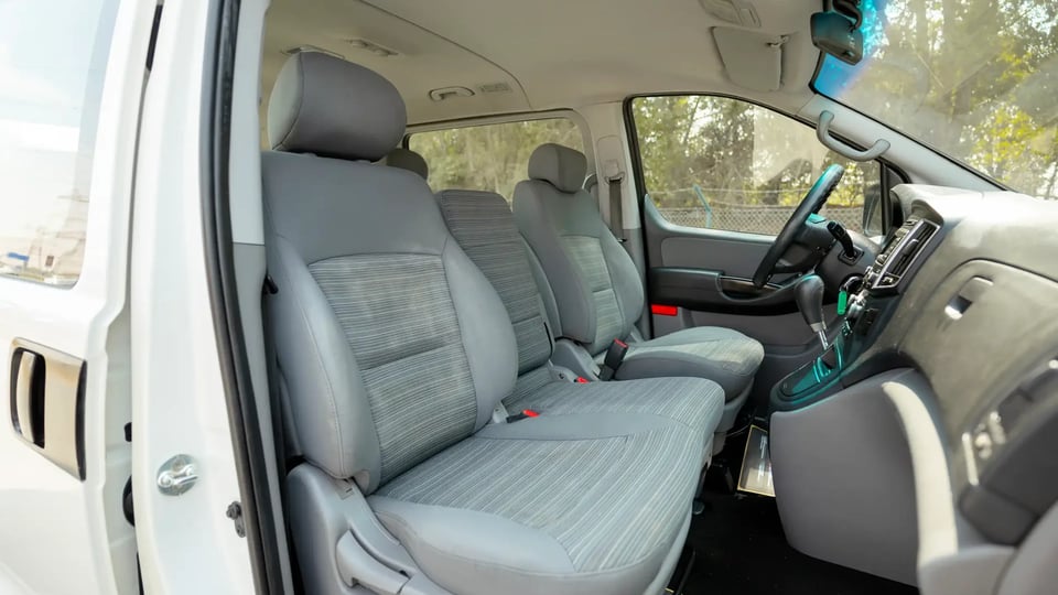 Used 2021 Hyundai H1 12-Seater Wagon in White – Front Passenger Side Cabin View for Sale at First Choice Cars Dubai Sharjah