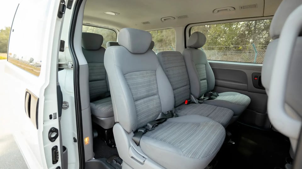 Used 2021 Hyundai H1 12-Seater Wagon in White – Rear Passenger Side Cabin View for Sale at First Choice Cars Dubai Sharjah
