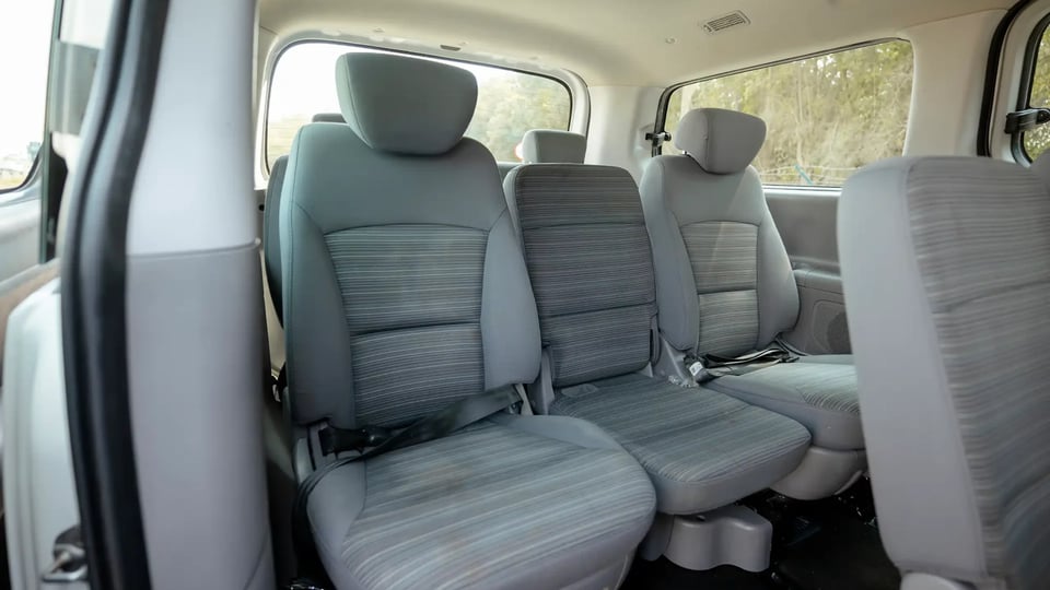 Used 2021 Hyundai H1 12-Seater Wagon in White – Third Row Right Seat View for Sale at First Choice Cars Dubai Sharjah