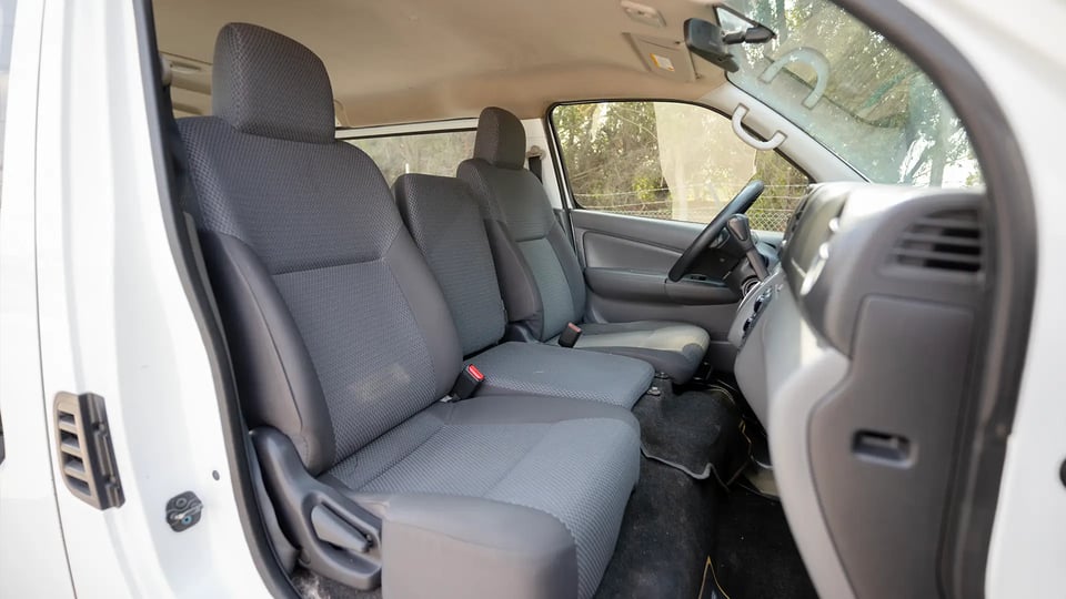 Used 2022 Nissan Urvan Standard Roof in White – Front Passenger Side Cabin View for Sale at First Choice Cars Dubai Sharjah