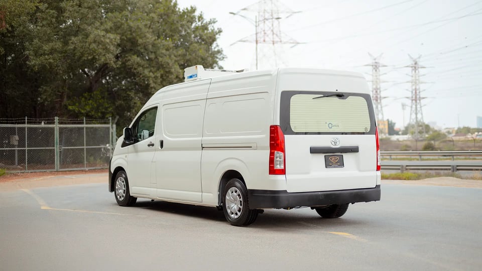 Used 2020 Toyota Hiace GLX High Roof in White – Left Back Diagonal (45°) View for Sale at First Choice Cars Dubai Sharjah