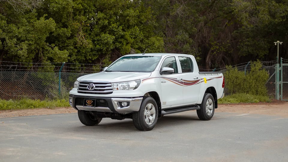 Used 2019 Toyota Hilux DLX Double Cabin in White – Left Front Diagonal (45°) View for Sale at First Choice Cars Dubai Sharjah