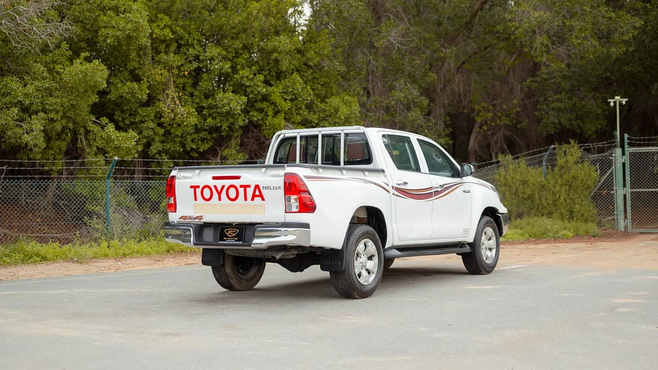 Used 2019 Toyota Hilux DLX Double Cabin in White – Right Back Diagonal (45°) View for Sale at First Choice Cars Dubai Sharjah