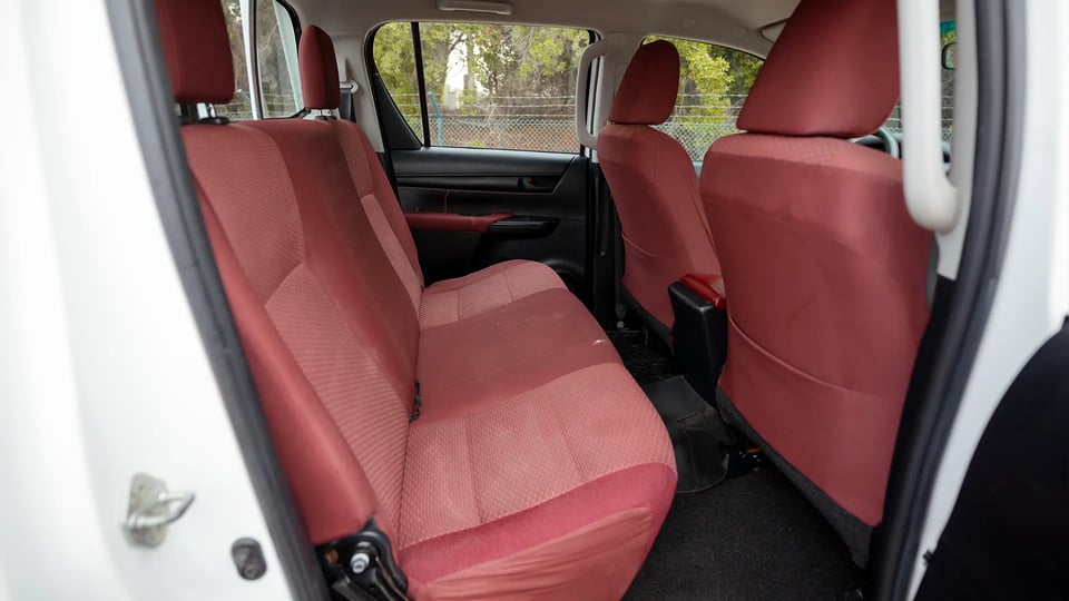 Used 2019 Toyota Hilux DLX Double Cabin in White – Rear Passenger Side Cabin View for Sale at First Choice Cars Dubai Sharjah