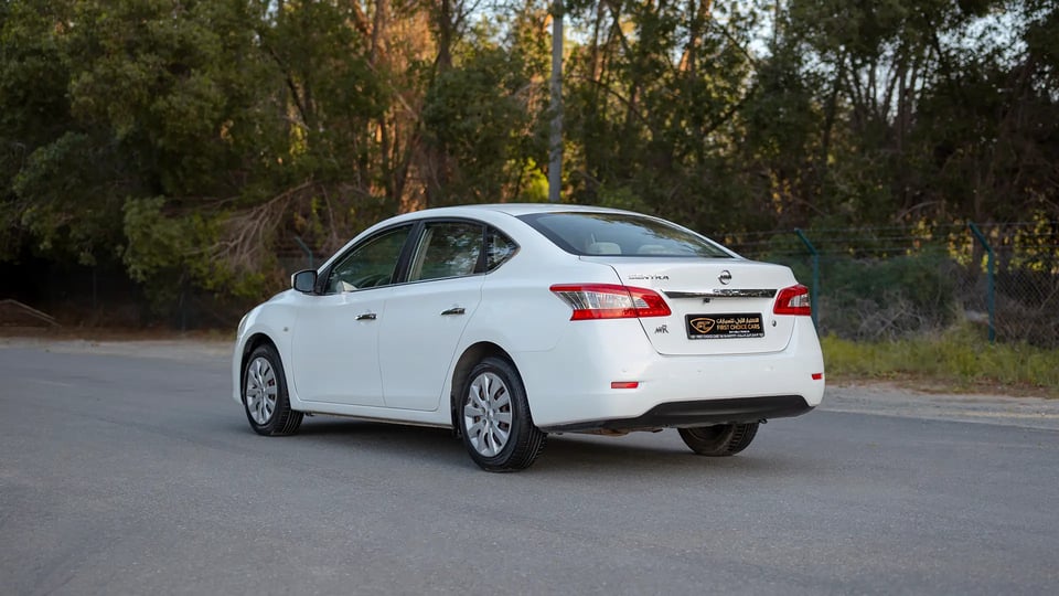 Used 2019 Nissan Sentra S in White – Left Back Diagonal (45°) View for Sale at First Choice Cars Dubai Sharjah