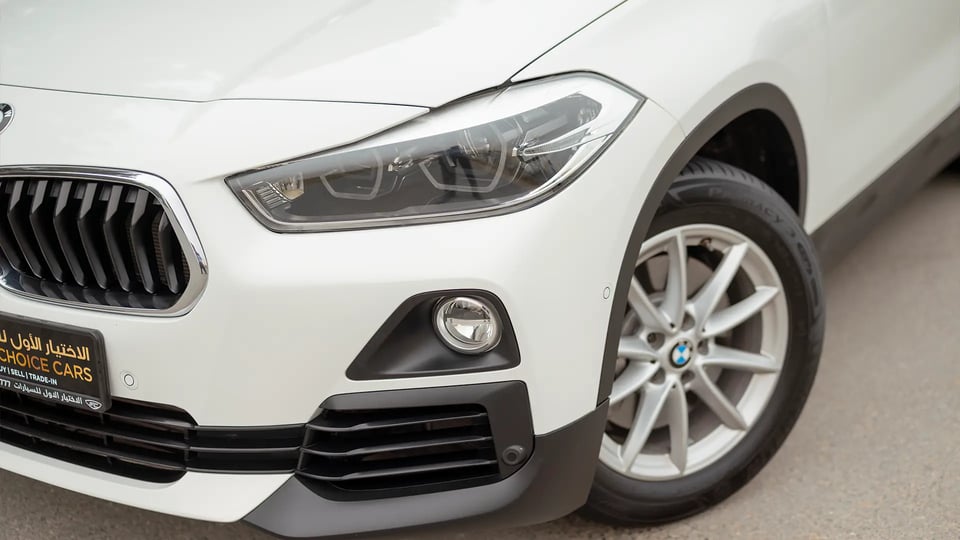 Used 2020 BMW X2 S-Drive 20i in White – Headlight Close-up for Sale at First Choice Cars Dubai Sharjah