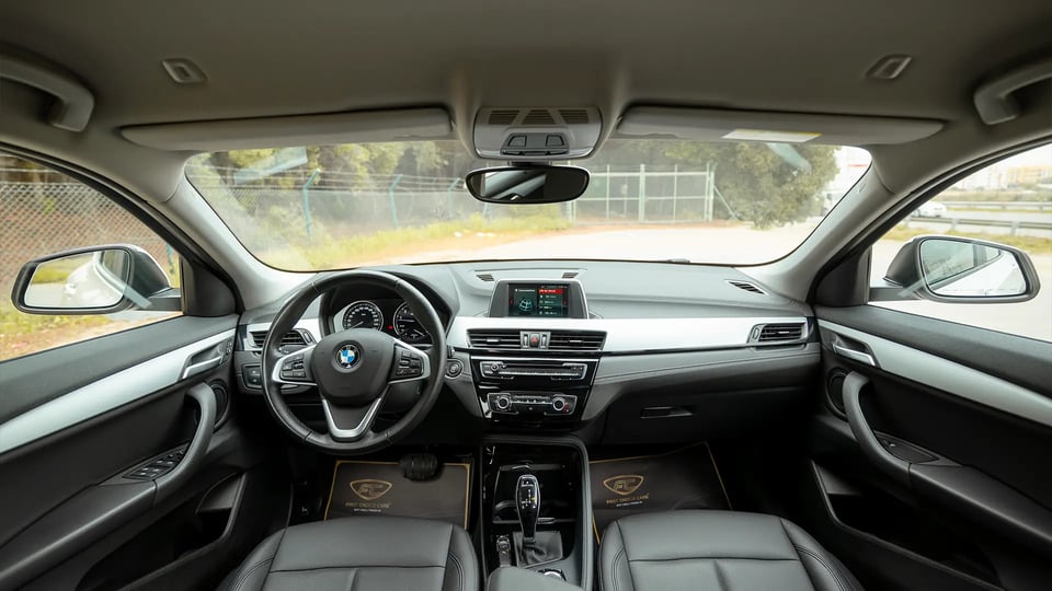 Used 2020 BMW X2 S-Drive 20i in White – Front Cabin / Dashboard Full View for Sale at First Choice Cars Dubai Sharjah