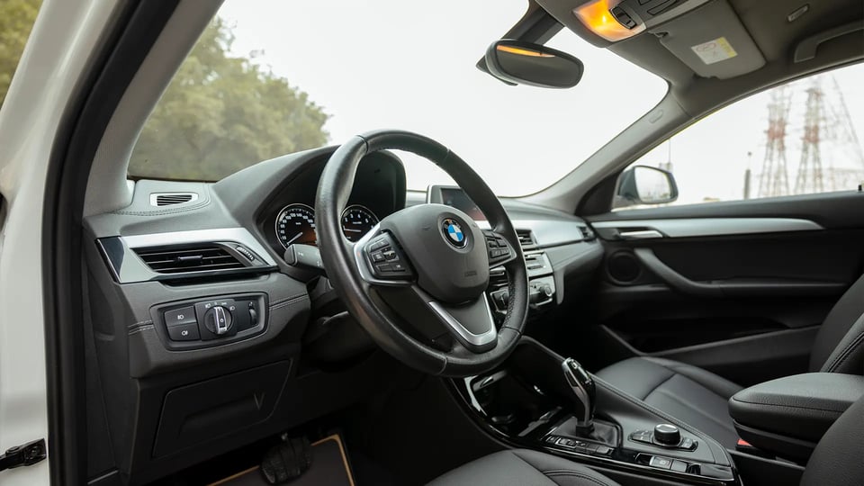 Used 2020 BMW X2 S-Drive 20i in White – Driver Side Dashboard & Steering View for Sale at First Choice Cars Dubai Sharjah