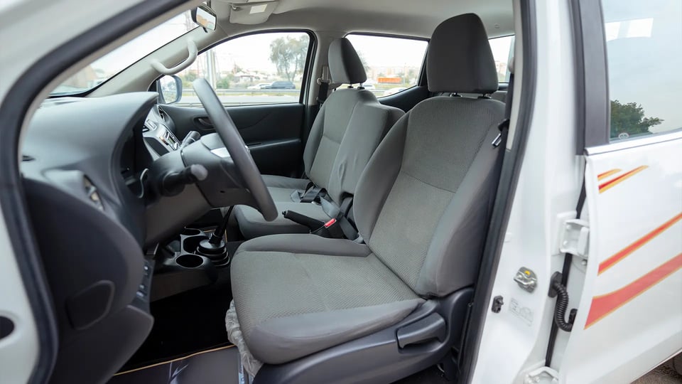 Used 2022 Nissan Navara Asf 2.5L G 2wd Mt in White – Front Driver Side Cabin View for Sale at First Choice Cars Dubai Sharjah