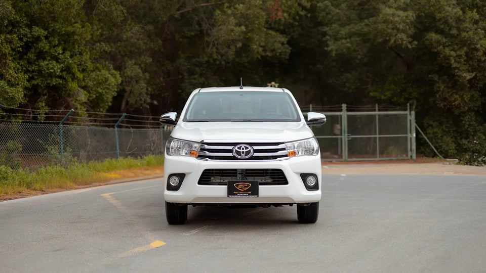 Used 2024 Toyota Hilux GL Double Cabin in White – Front View for Sale at First Choice Cars Dubai Sharjah