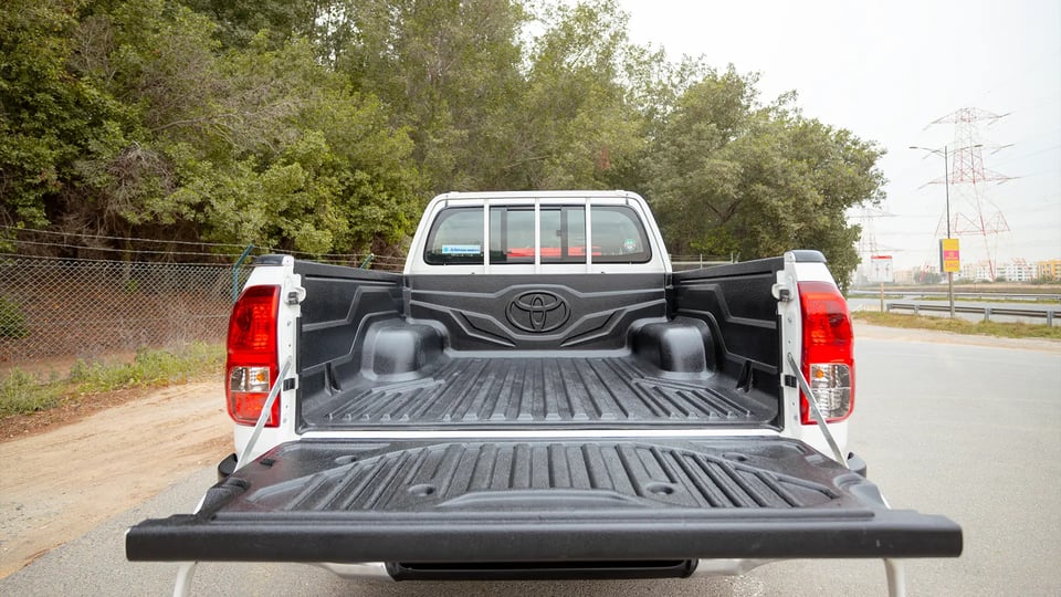 Used 2024 Toyota Hilux GL Double Cabin in White – Boot / Trunk Space Open View for Sale at First Choice Cars Dubai Sharjah