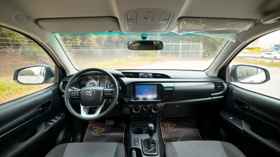 Used 2024 Toyota Hilux GL Double Cabin in White – Front Cabin / Dashboard Full View for Sale at First Choice Cars Dubai Sharjah