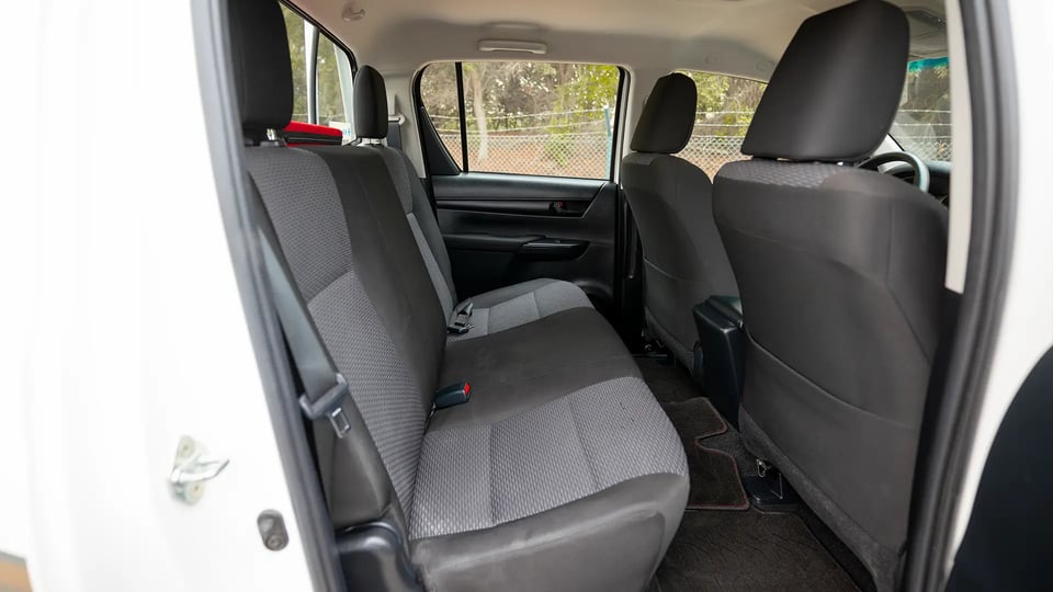 Used 2024 Toyota Hilux GL Double Cabin in White – Rear Passenger Side Cabin View for Sale at First Choice Cars Dubai Sharjah