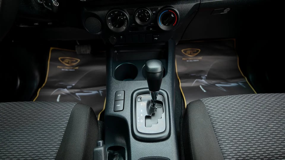 Used 2024 Toyota Hilux GL Double Cabin in White – Center Console & Gear Shifter for Sale at First Choice Cars Dubai Sharjah