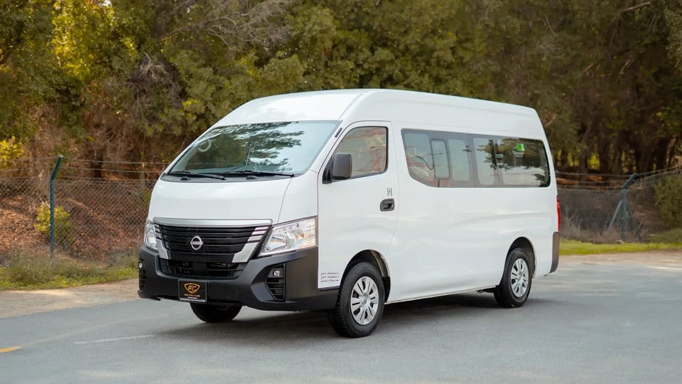 Used 2023 Nissan Urvan High Roof in White – Left Front Diagonal (45°) View for Sale at First Choice Cars Dubai Sharjah