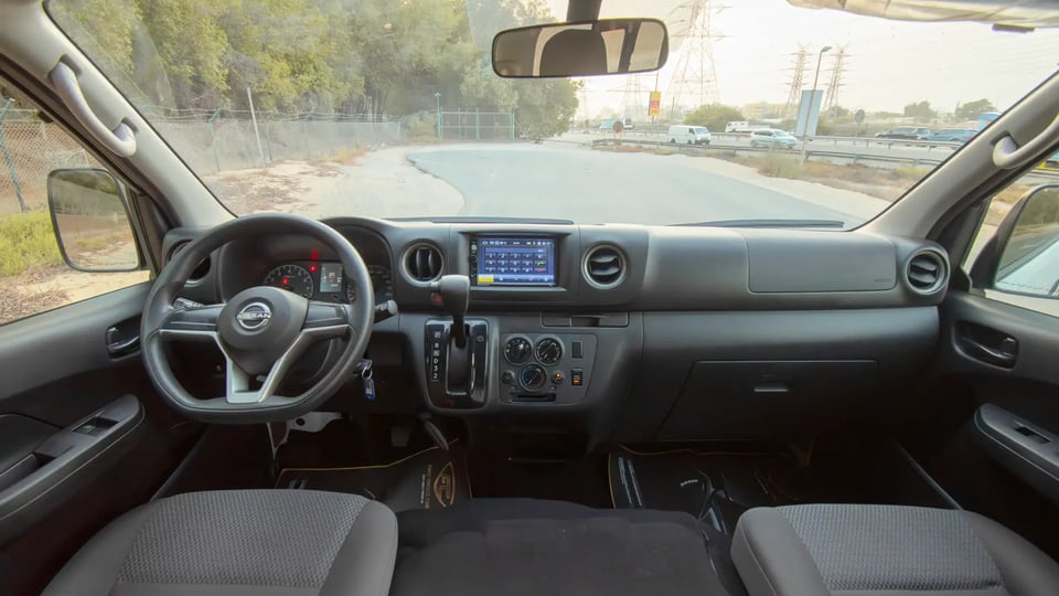 Used 2023 Nissan Urvan High Roof in White – Front Cabin / Dashboard Full View for Sale at First Choice Cars Dubai Sharjah