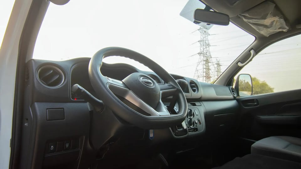 Used 2023 Nissan Urvan High Roof in White – Driver Side Dashboard & Steering View for Sale at First Choice Cars Dubai Sharjah
