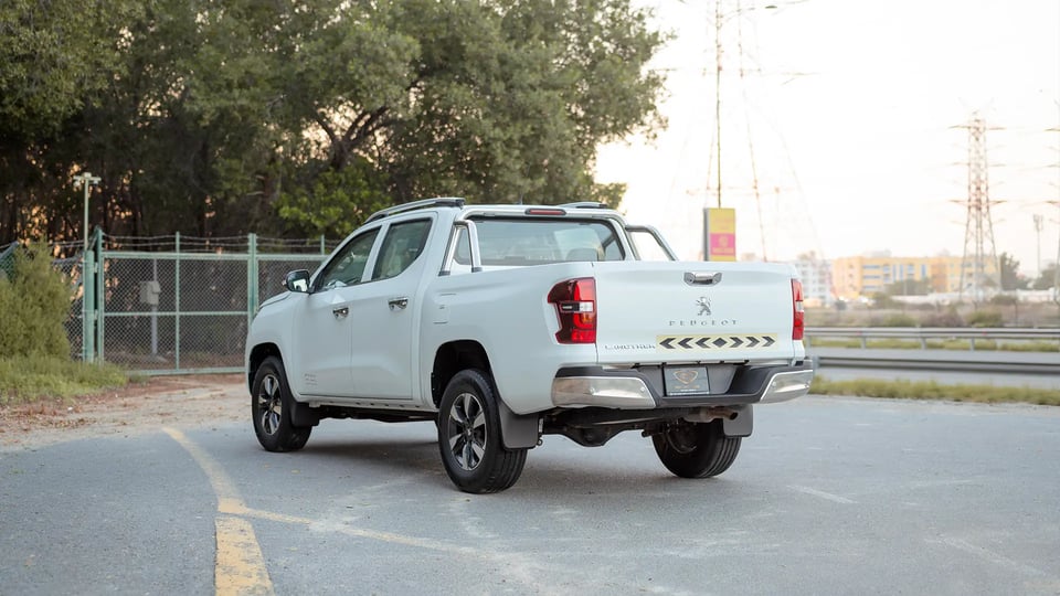 Used 2023 Peugeot Landtrek Double Cabin in White – Left Back Diagonal (45°) View for Sale at First Choice Cars Dubai Sharjah