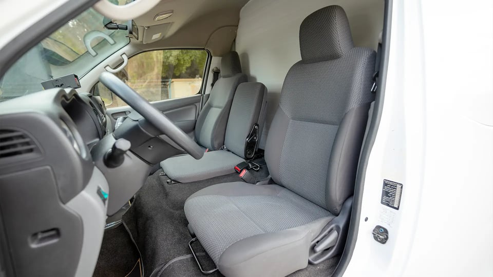 Used 2022 Nissan Urvan High Roof in White – Front Driver Side Cabin View for Sale at First Choice Cars Dubai Sharjah